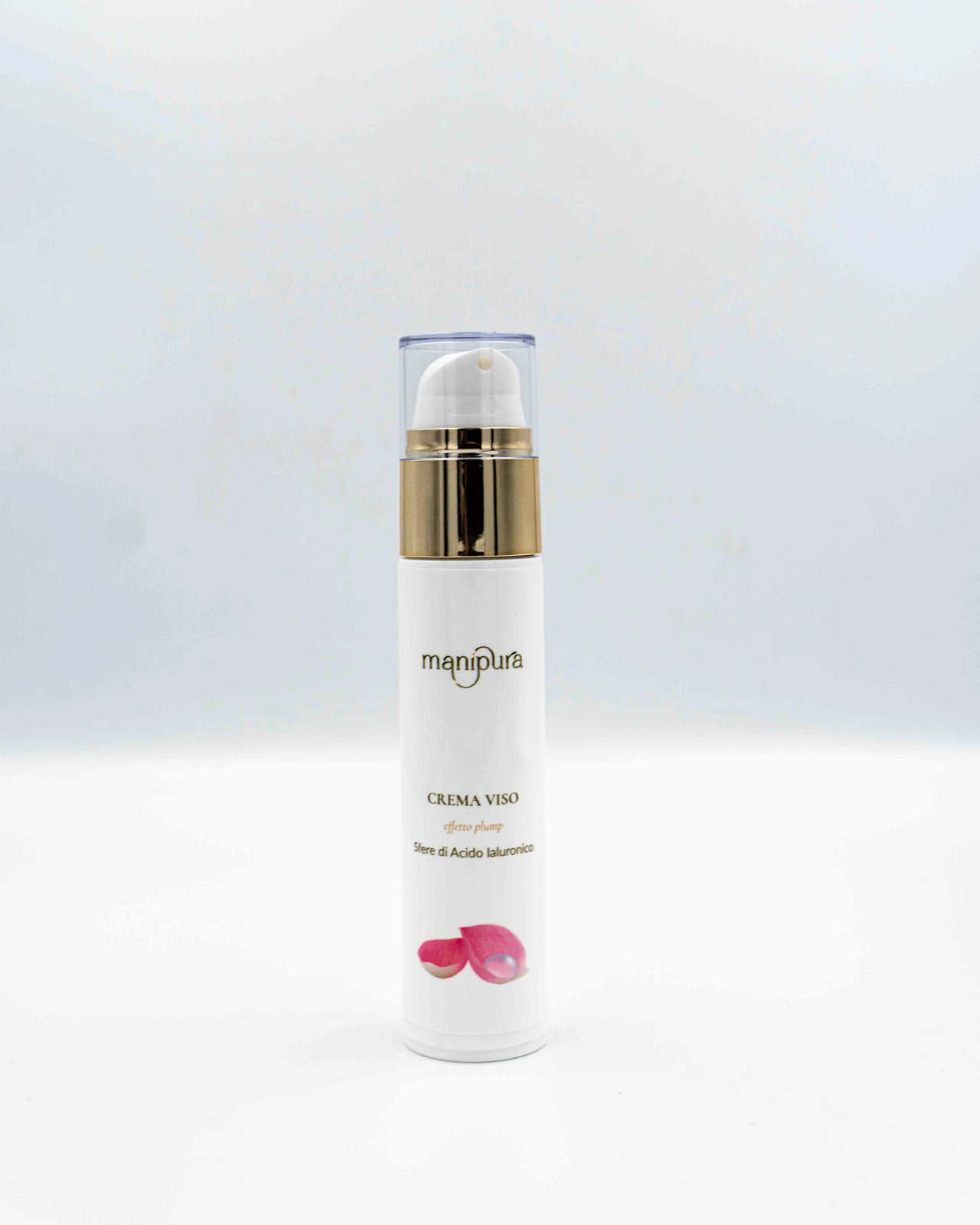 Flacone frontale della crema viso effetto plump Manipura, con tappo trasparente e grafica rosa, su sfondo bianco.