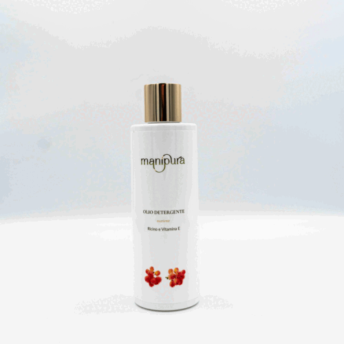 Flacone frontale di olio detergente Manipura con ricino e vitamina E, tappo dorato e grafica floreale su sfondo bianco.